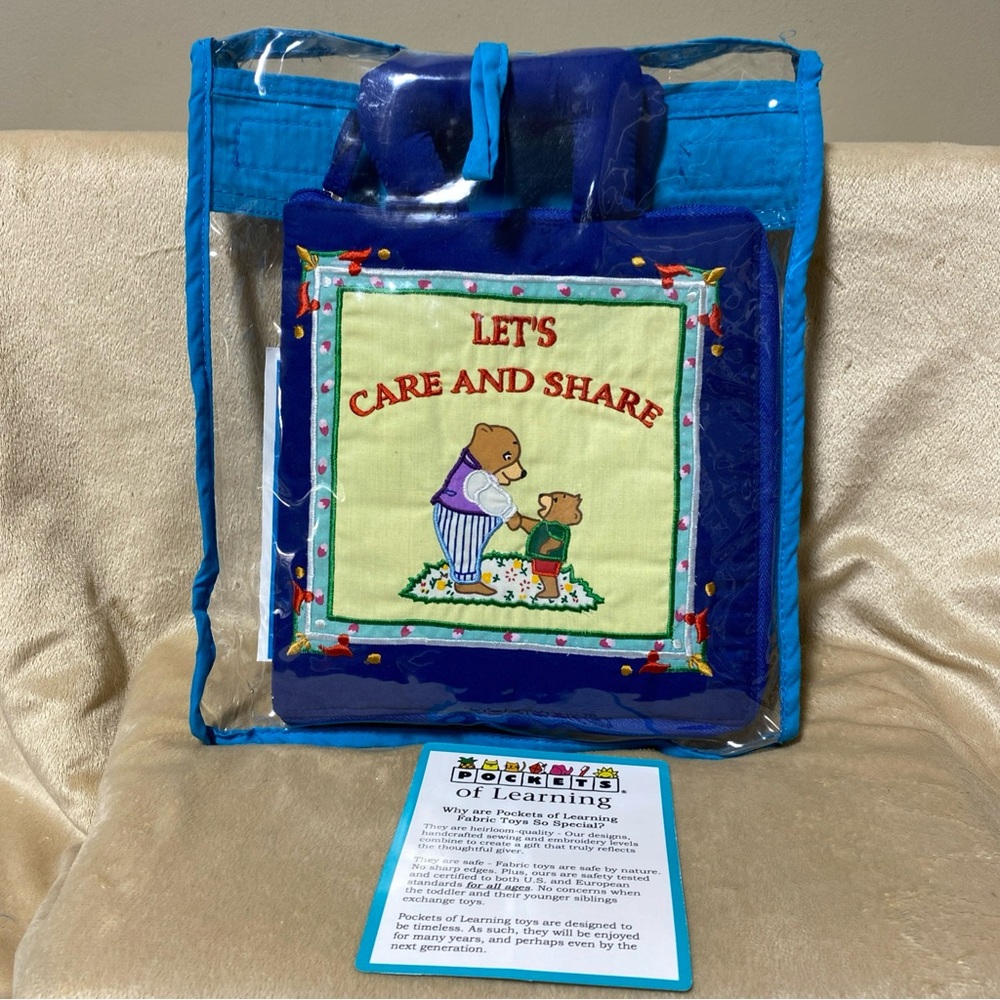 Pockets of Learning Cloth Baby/Toddler
Activity Book "Let's Care And Share"